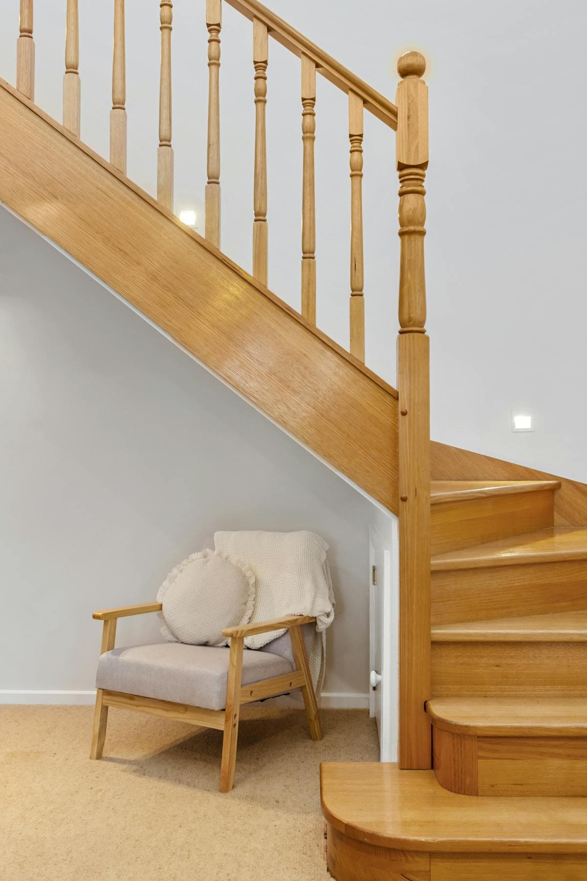 Bespoke under-stairs storage with drawers and cupboards in an Isle of Man home
