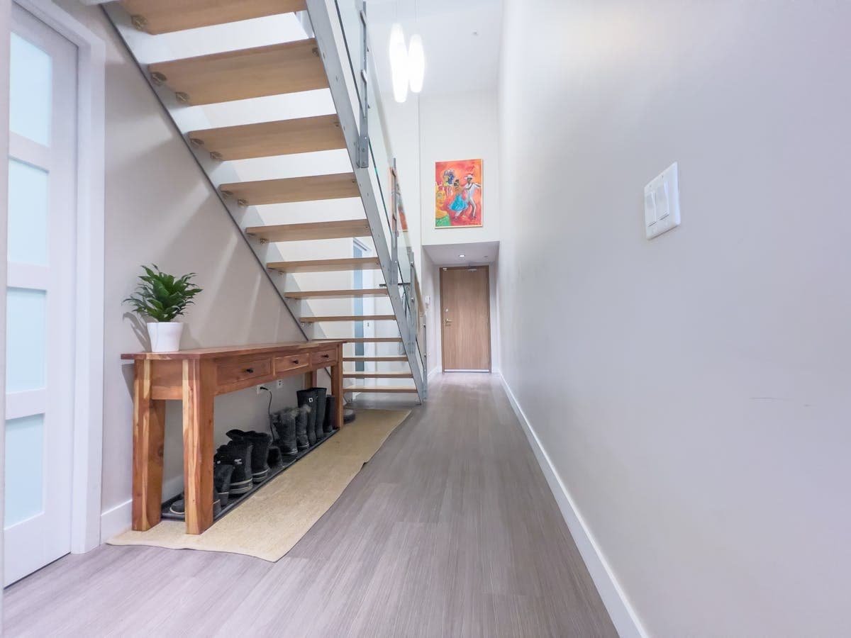 Real hallway and stair reference suitable for wall-panelling, stair-wall and trim inspiration.
