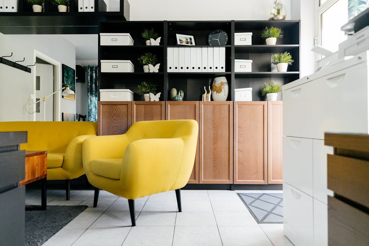 Real shelf-and-chair room reference suitable for compact office nook and study-storage inspiration.