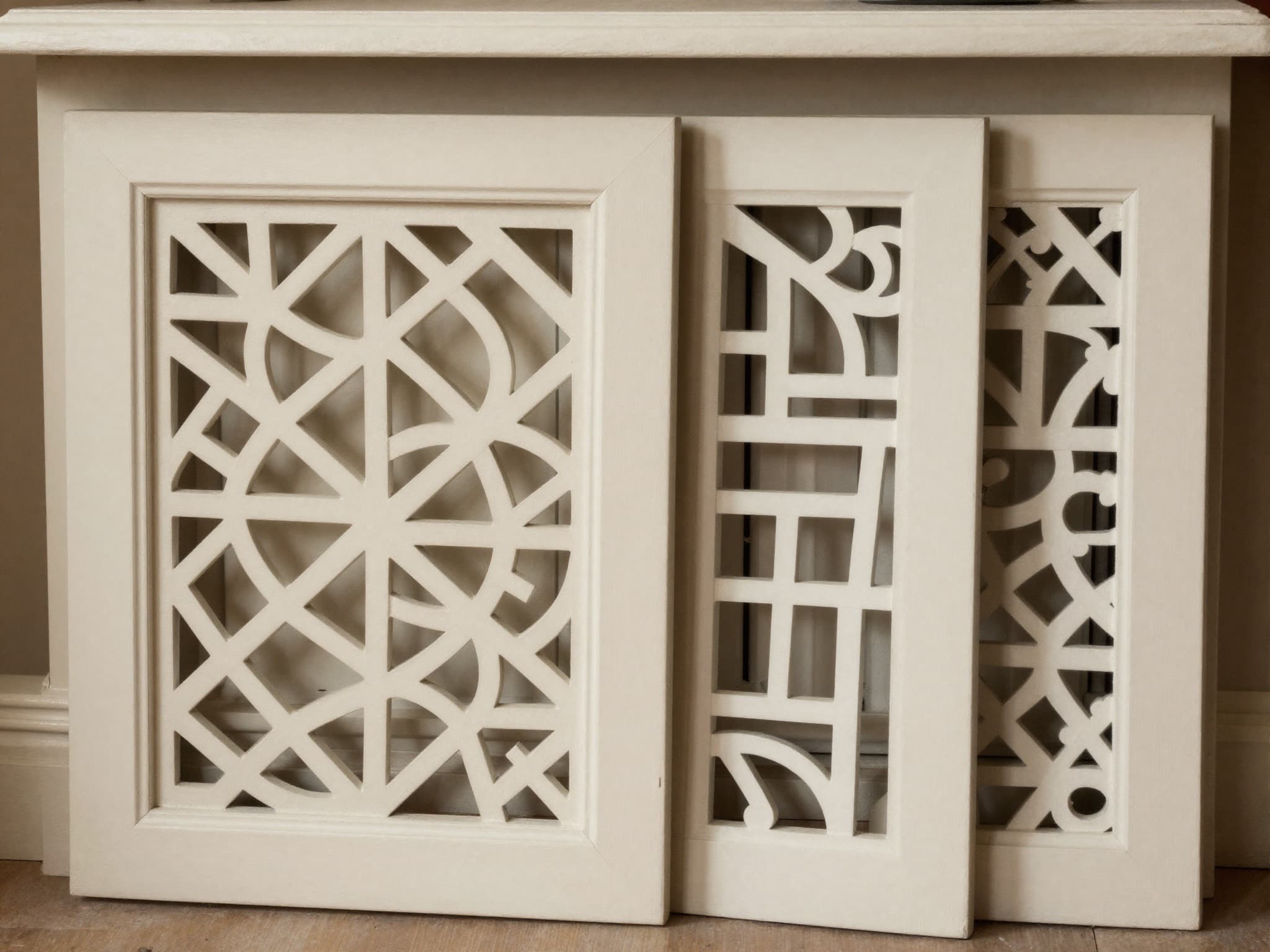 AI-generated illustration: decorative fretwork MDF grille panels fitted in a radiator cover and cabinet door with a freestanding sample.